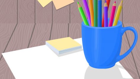 Color Pencils In Blue Mug With White Paper